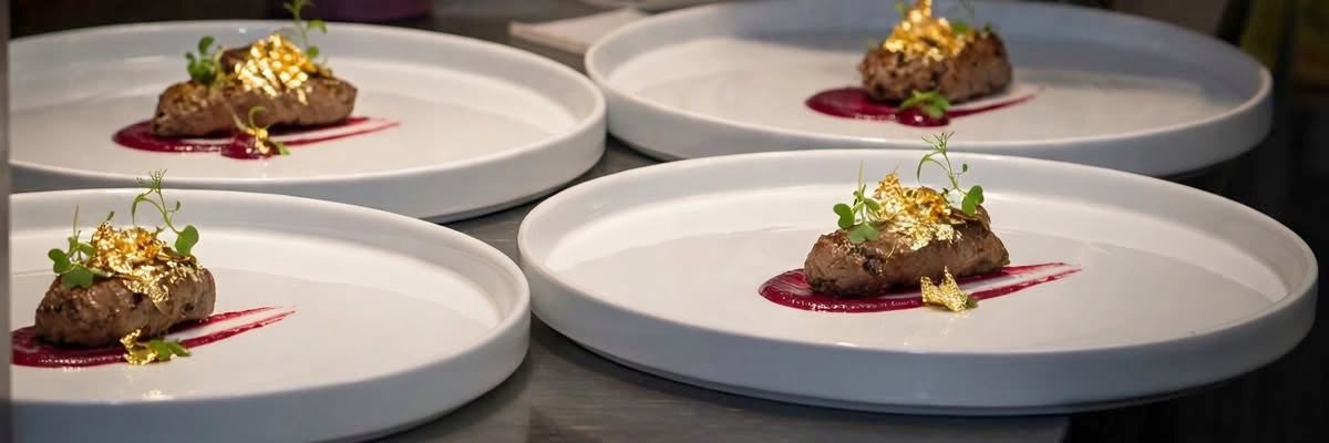 Gold-leaf topped chef&rsquo;s special dishes plated at 7eventy1, Appleby-in-Westmorland